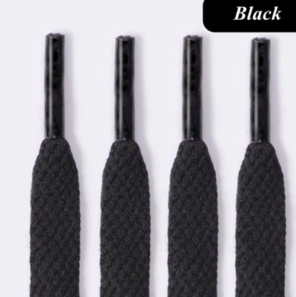 Close-up of four black flat shoe laces with aglets on light background, Black label