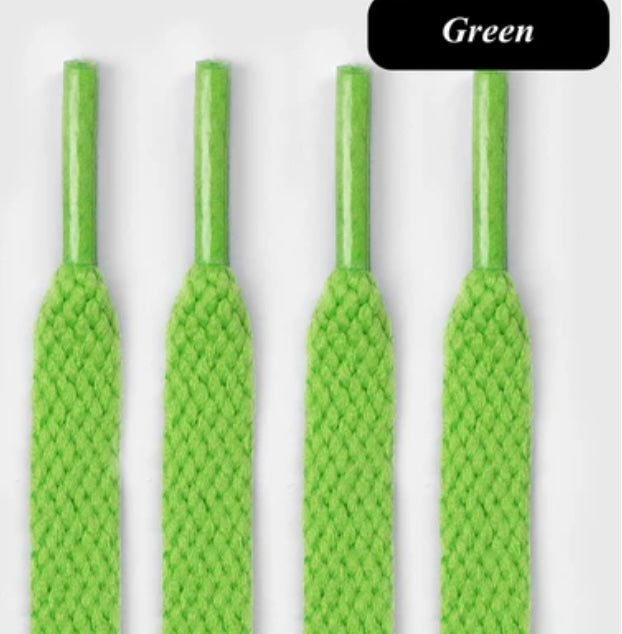 Bright green flat shoelaces close-up on white background